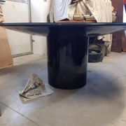 Black lacquered glass table and glass in the hoof style, Italy.