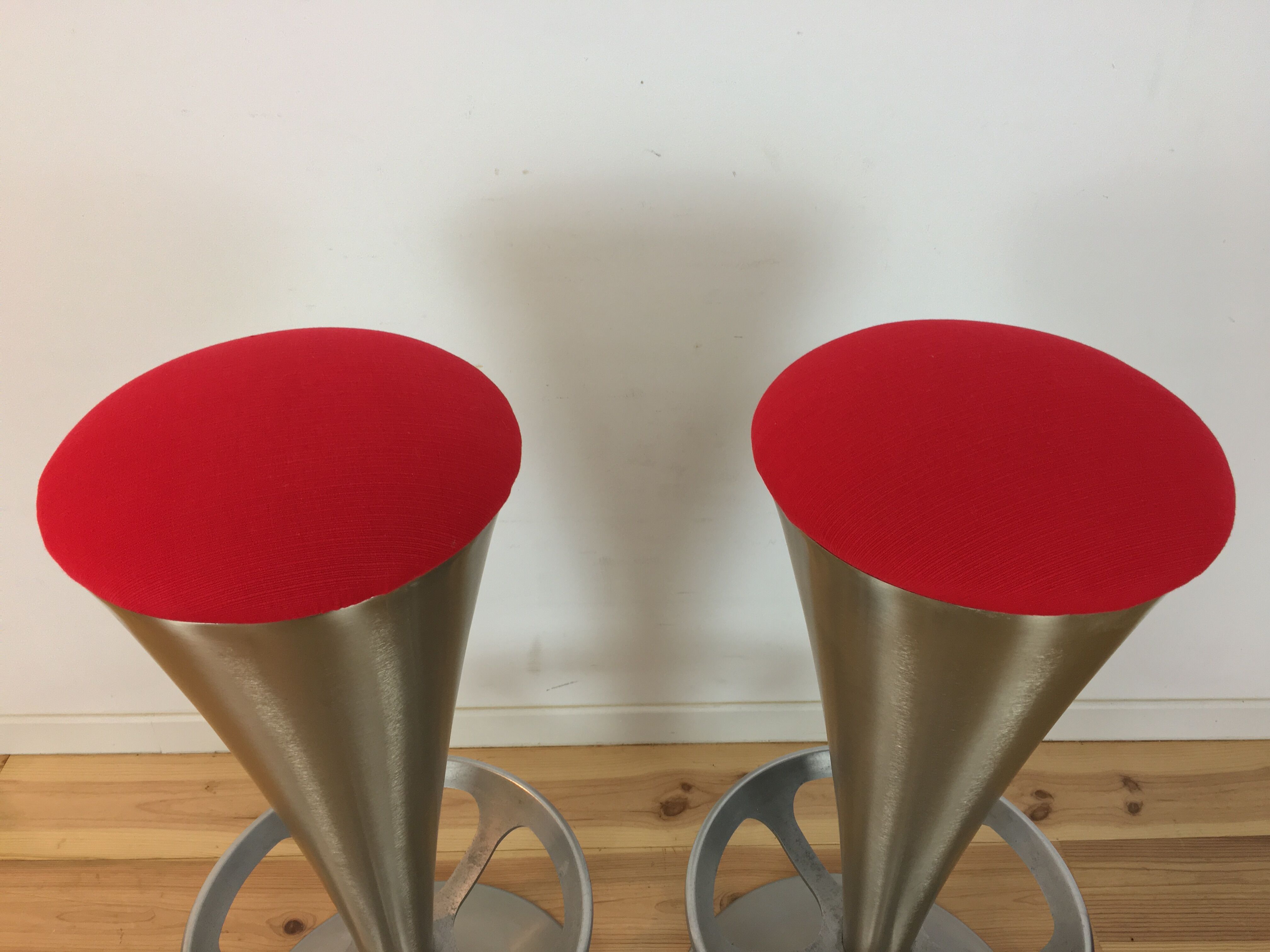 Pair of 70's style metal bar stools in pop red