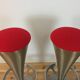 Pair of 70's style metal bar stools in pop red