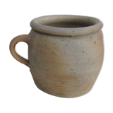 Ancient sandstone pot at one handle