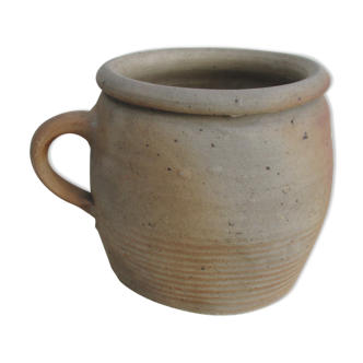 Ancient sandstone pot at one handle