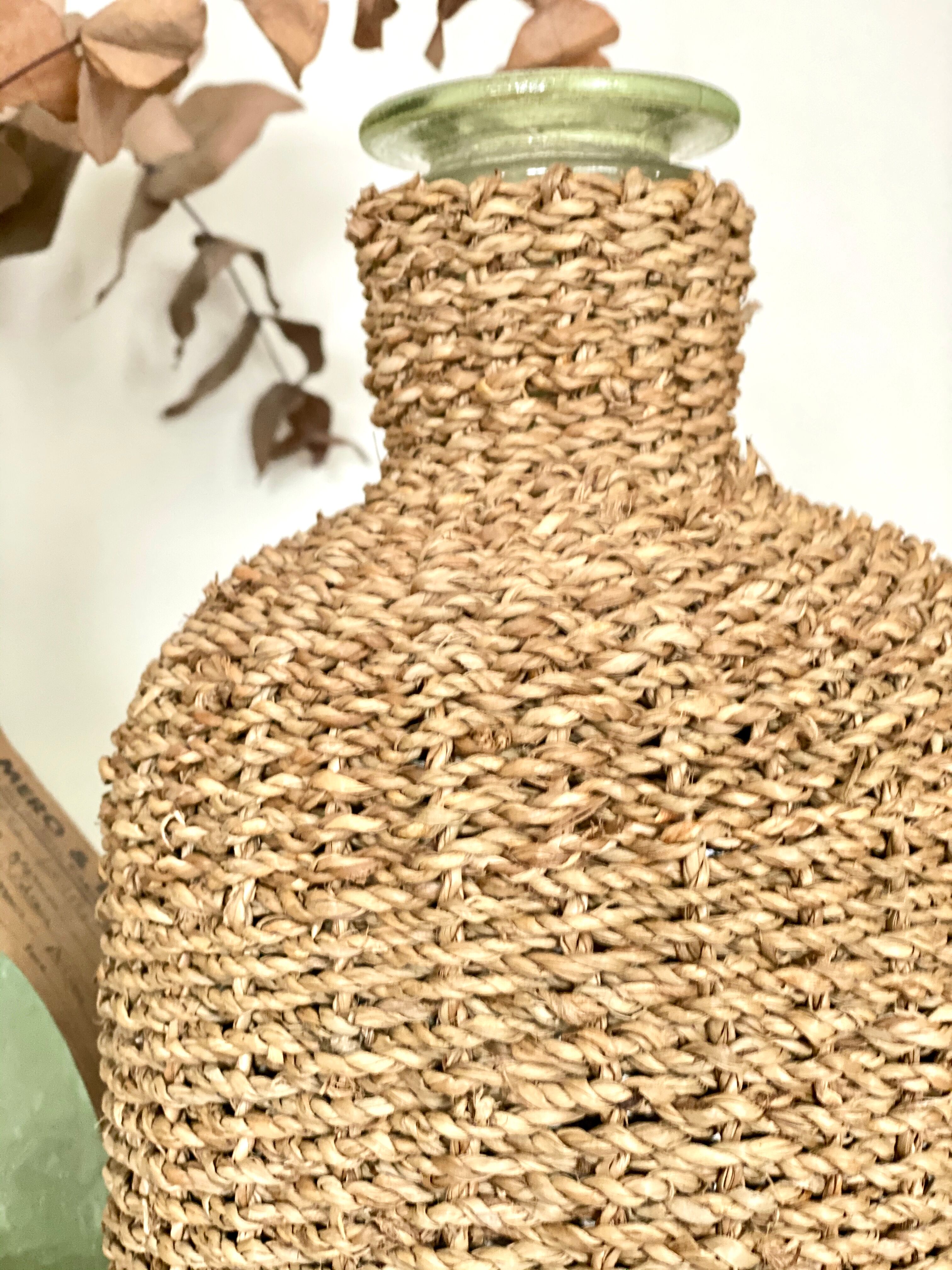 Glass bottle and braided rope