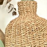 Glass bottle and braided rope