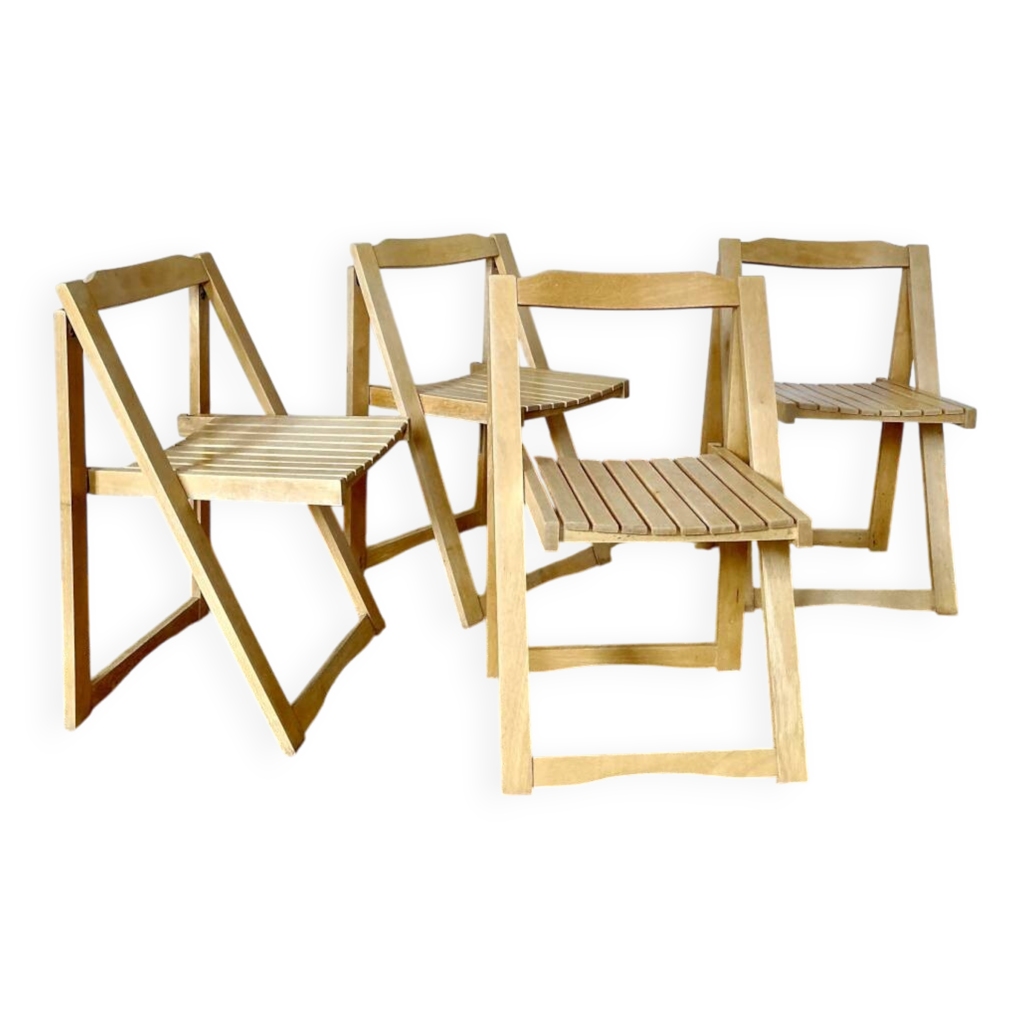 Folding chairs designed by Aldo Jacober in solid beech wood.