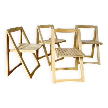 Folding chairs designed by Aldo Jacober in solid beech wood.