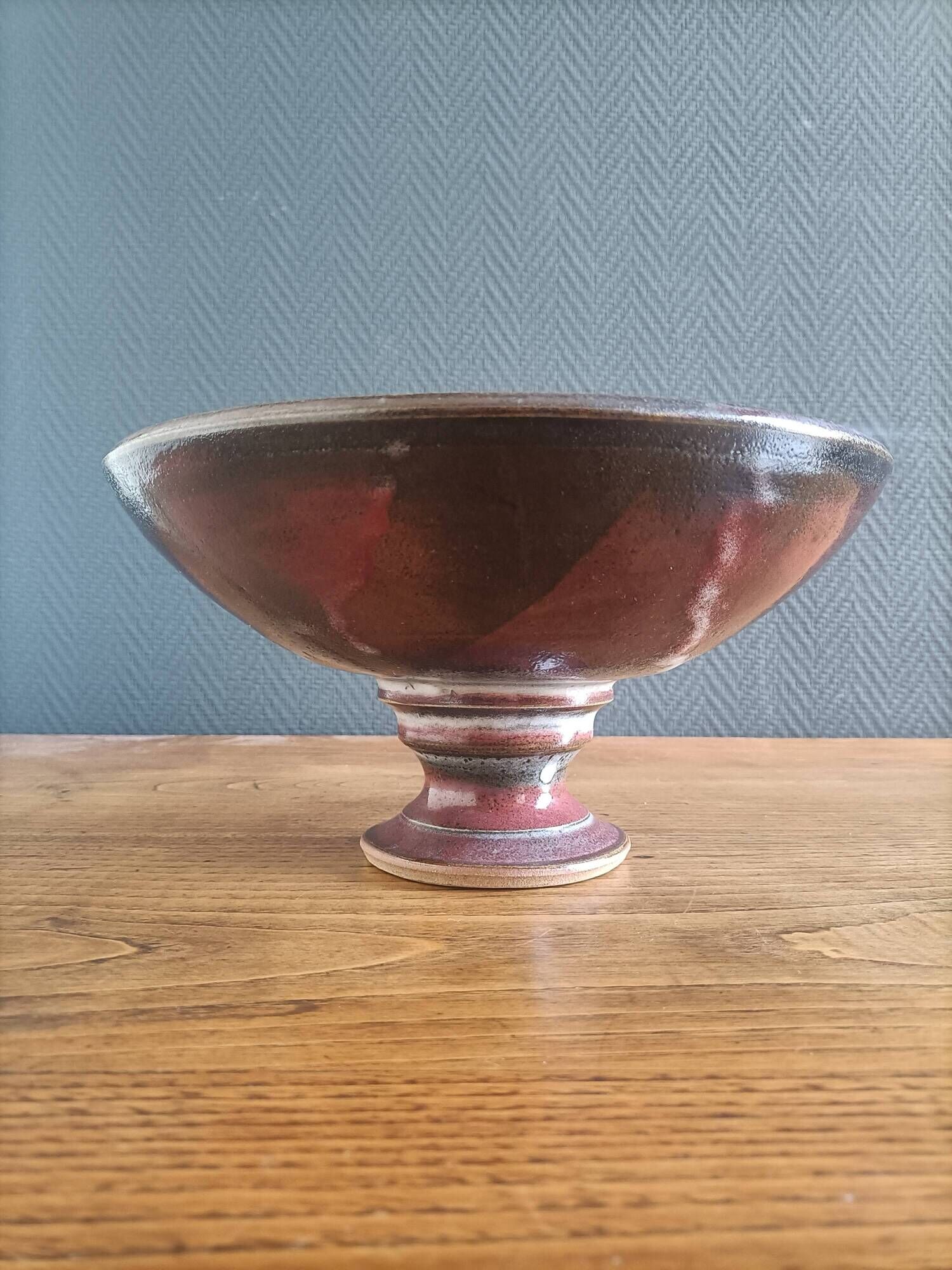 Signed ceramic fruit bowl on foot