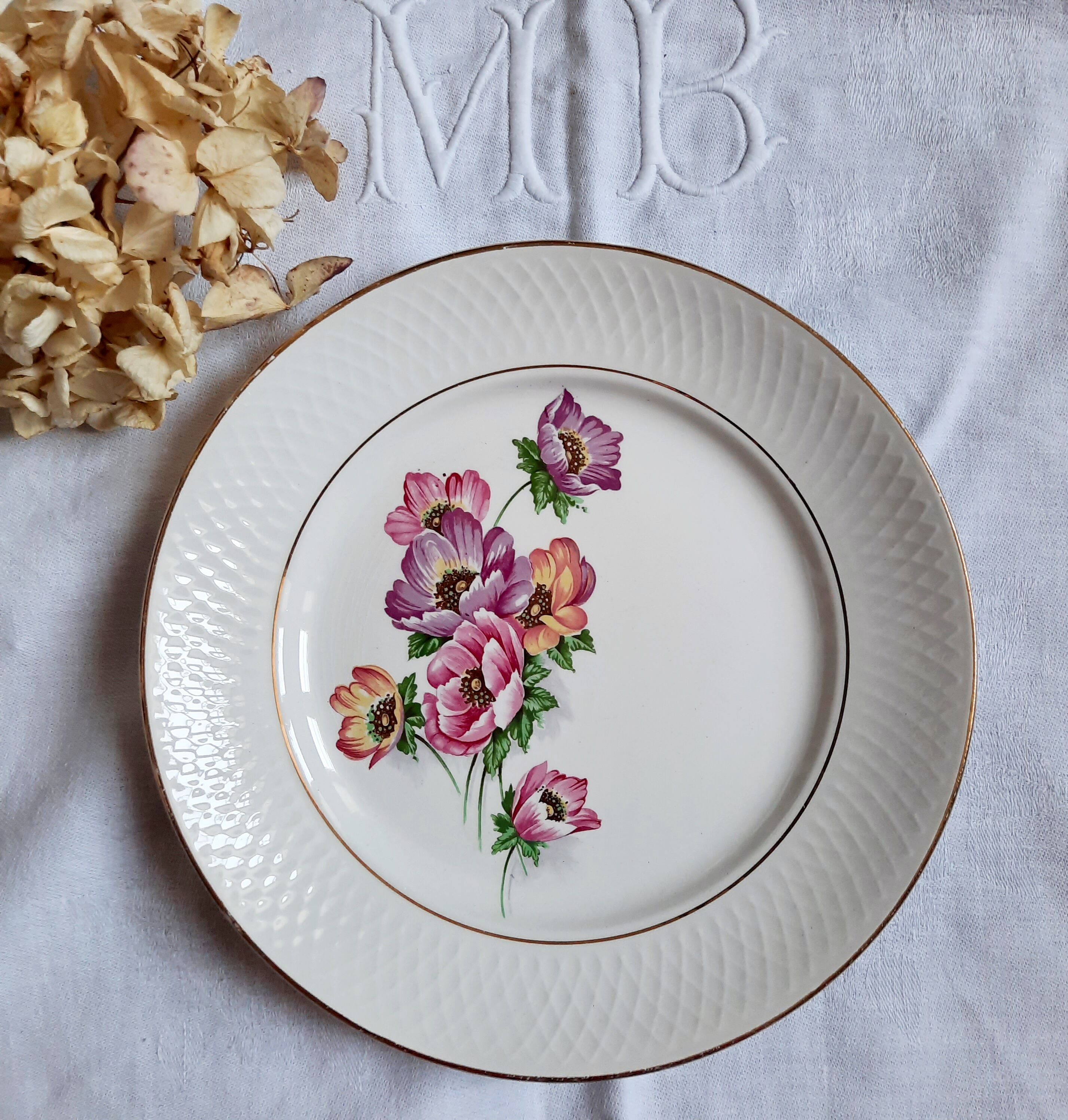 Flat antique earthenware plates with gilded edges