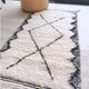 Berber carpet Béni Ouarain black and white with diamonds and braided border