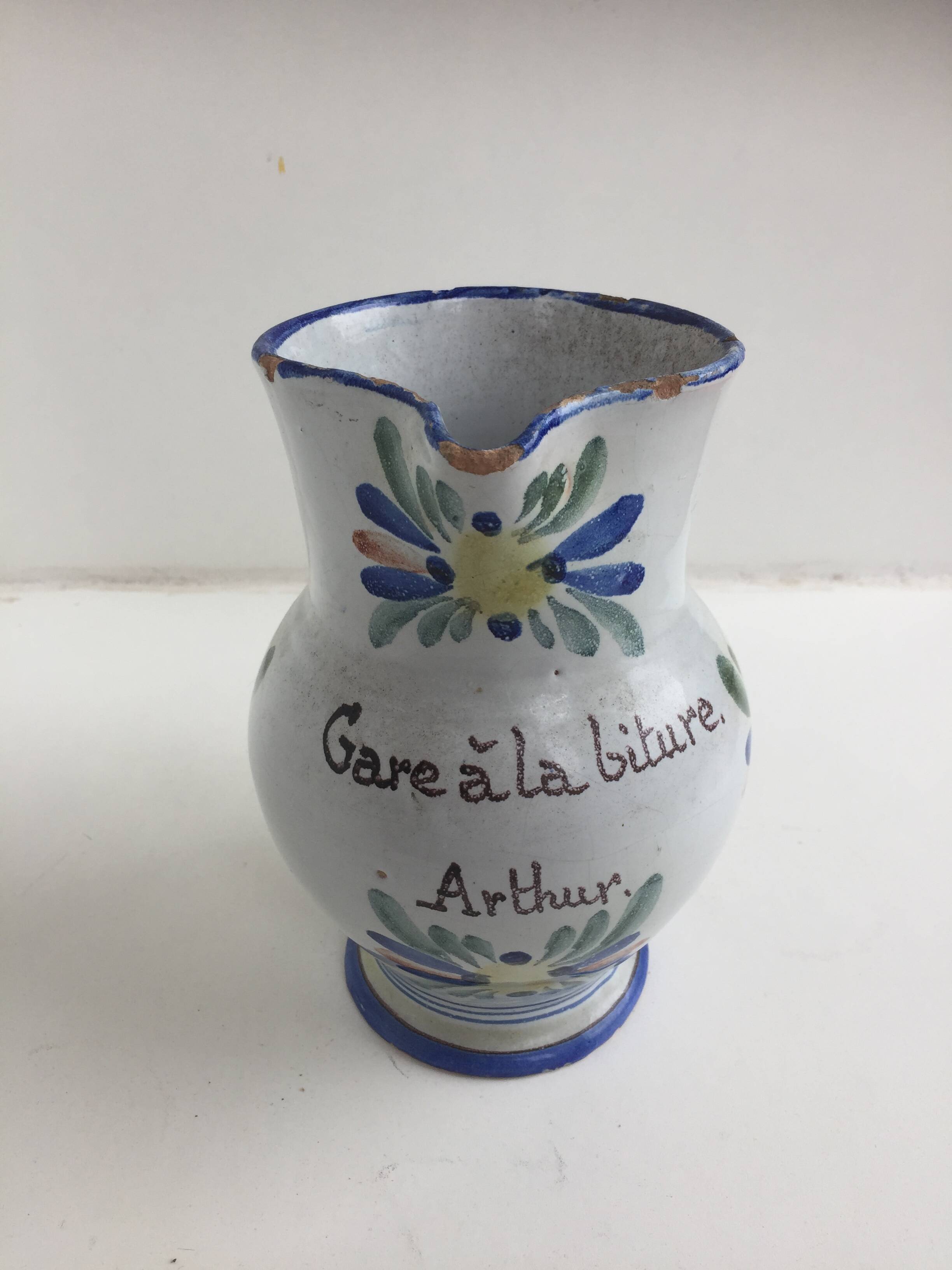 Old earthenware pitcher Beware at the Arthur biture