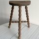 Tripod stool with turned wooden legs