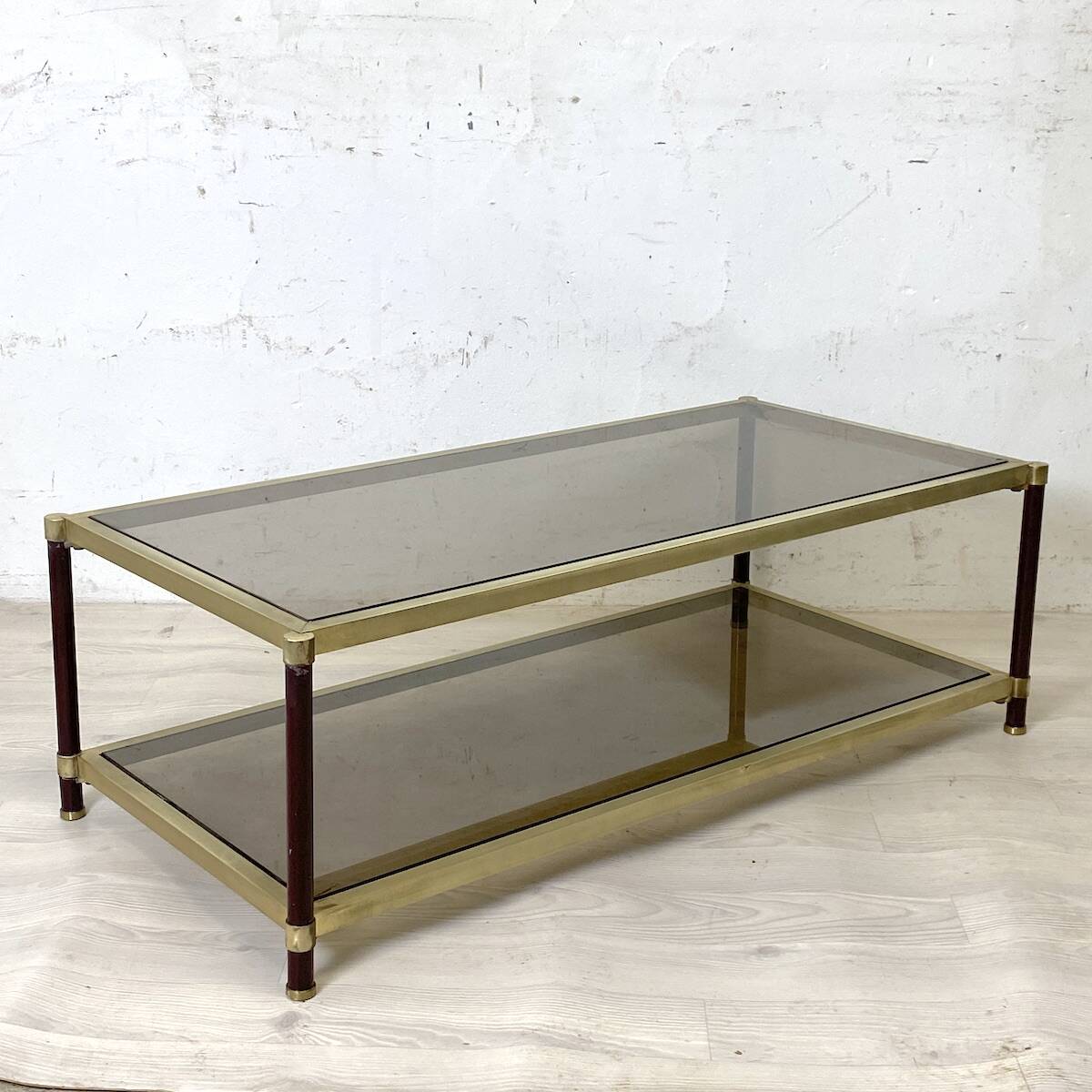 Vintage 1970s gold metal and smoked glass coffee table.