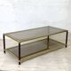 Vintage 1970s gold metal and smoked glass coffee table.
