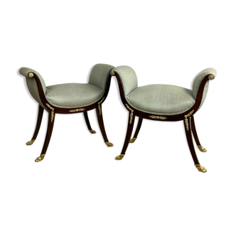 Pair of 19th century mahogany curule seats adorned with empire-style bronze