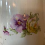 Old ceramic pitcher decorated with flowers