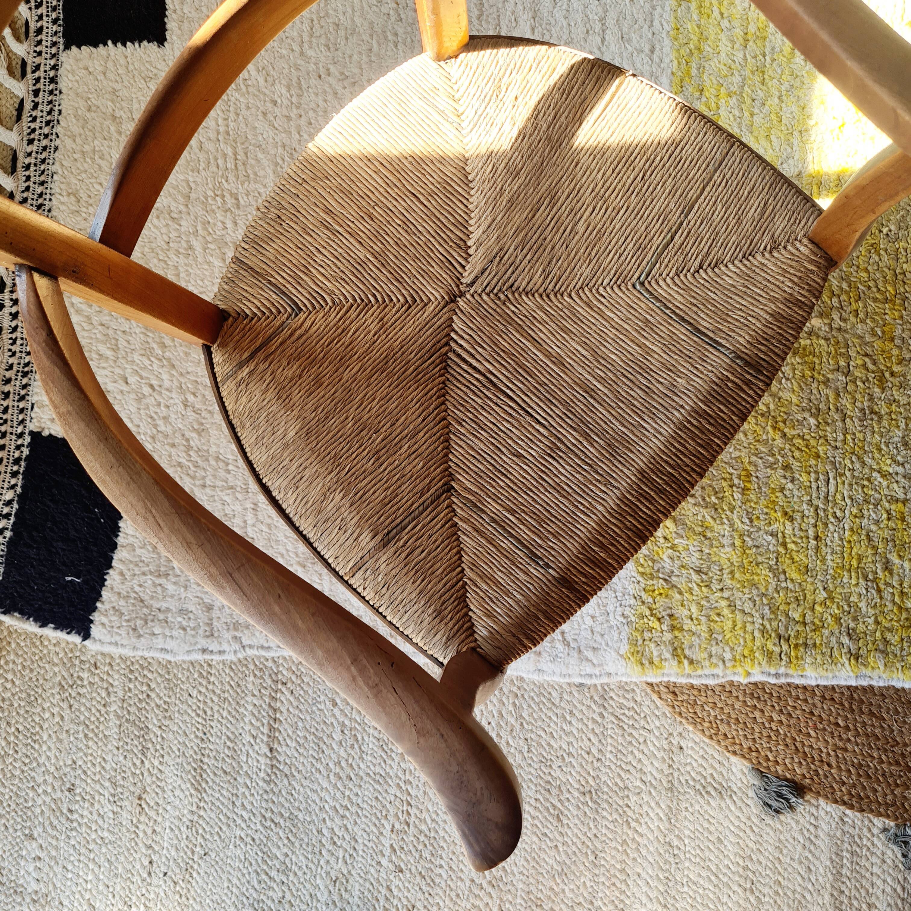 Antique campaign chair in wood and straw