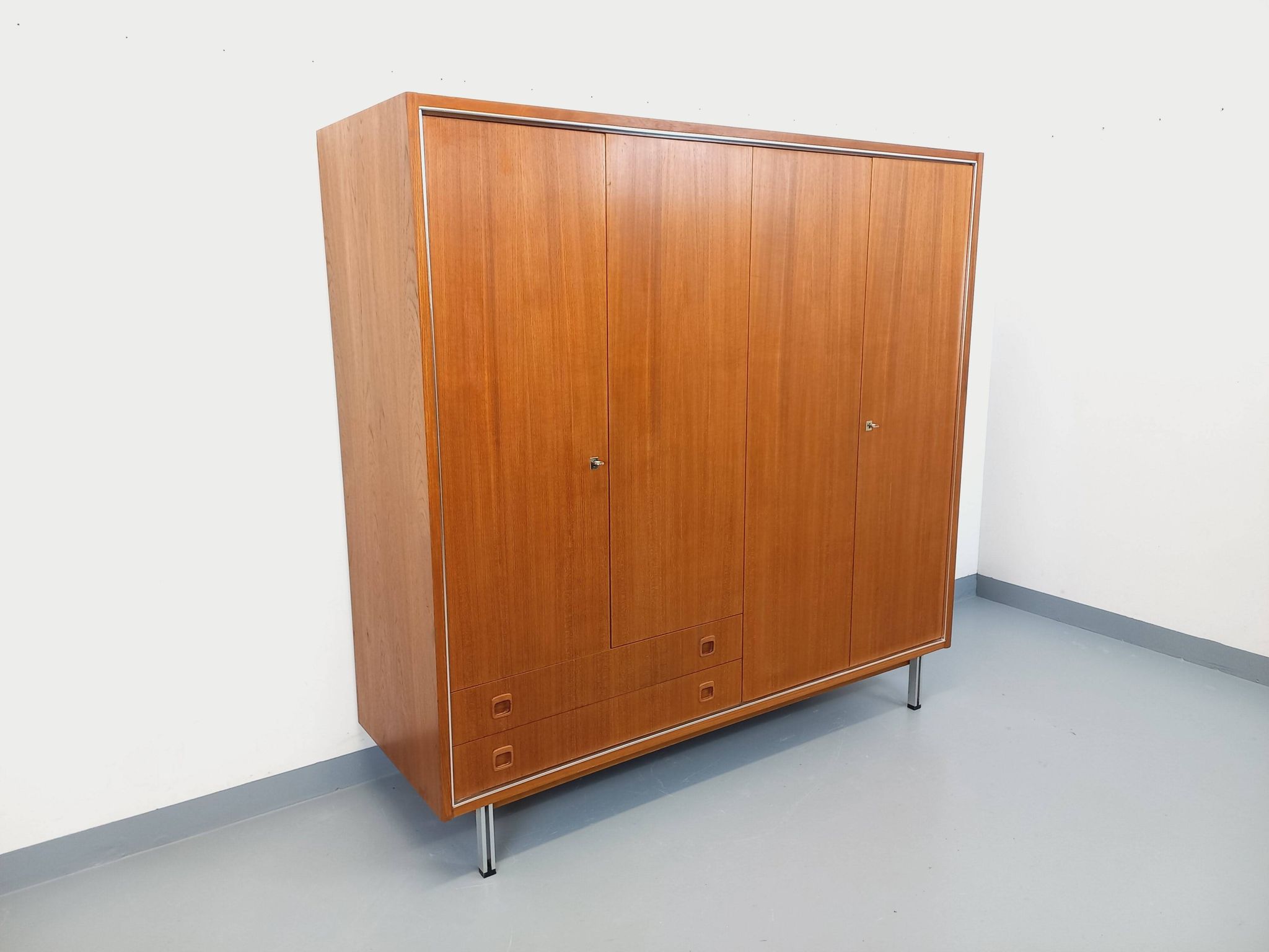 Vintage Scandinavian modernist wardrobe in teak and metal from the 1960s.