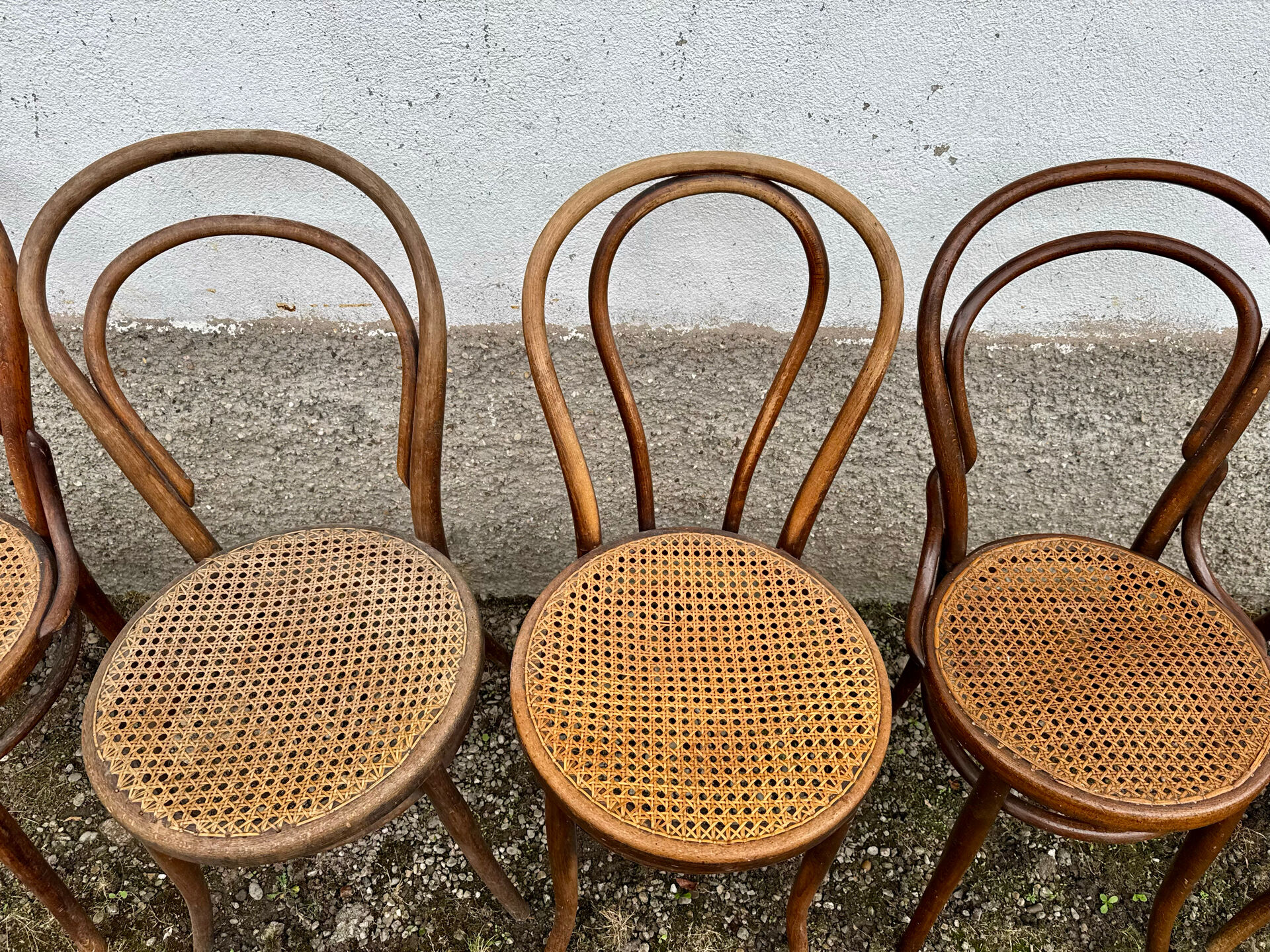 Set of 10 bentwood bistro chairs with cane seat.