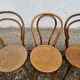 Set of 10 bentwood bistro chairs with cane seat.