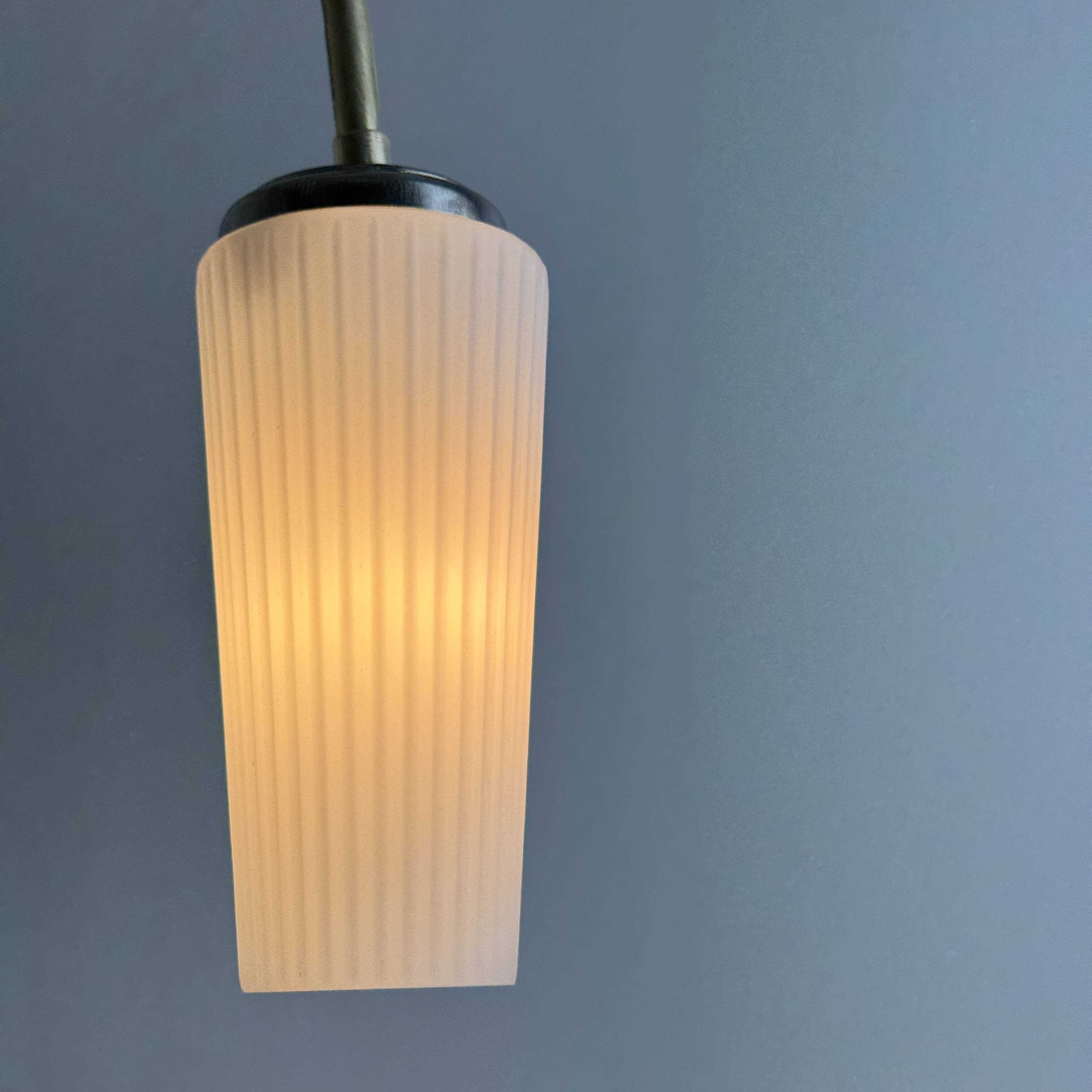 A pair of vintage opaline and brass wall lights