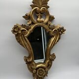 Wooden mirror with gilded stucco