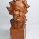Bust of a laughing child in patinated plaster, 35 cm
