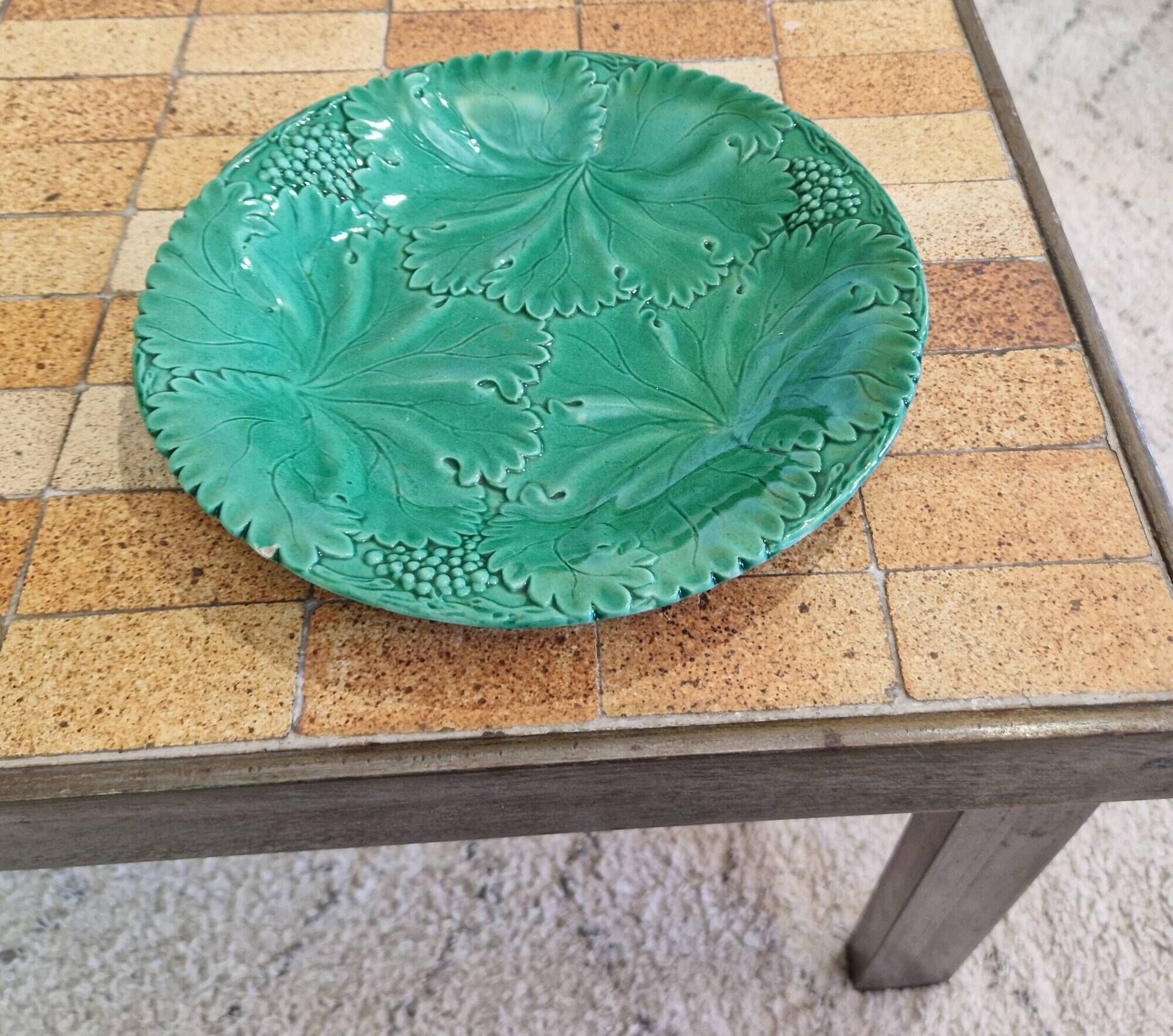 8 green barbotine plates from the early 20th century.
