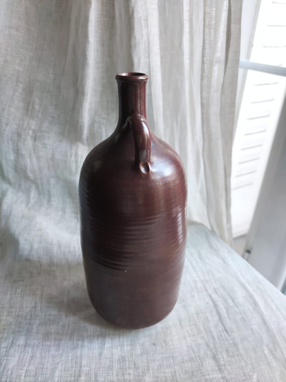 Large burgundy jar