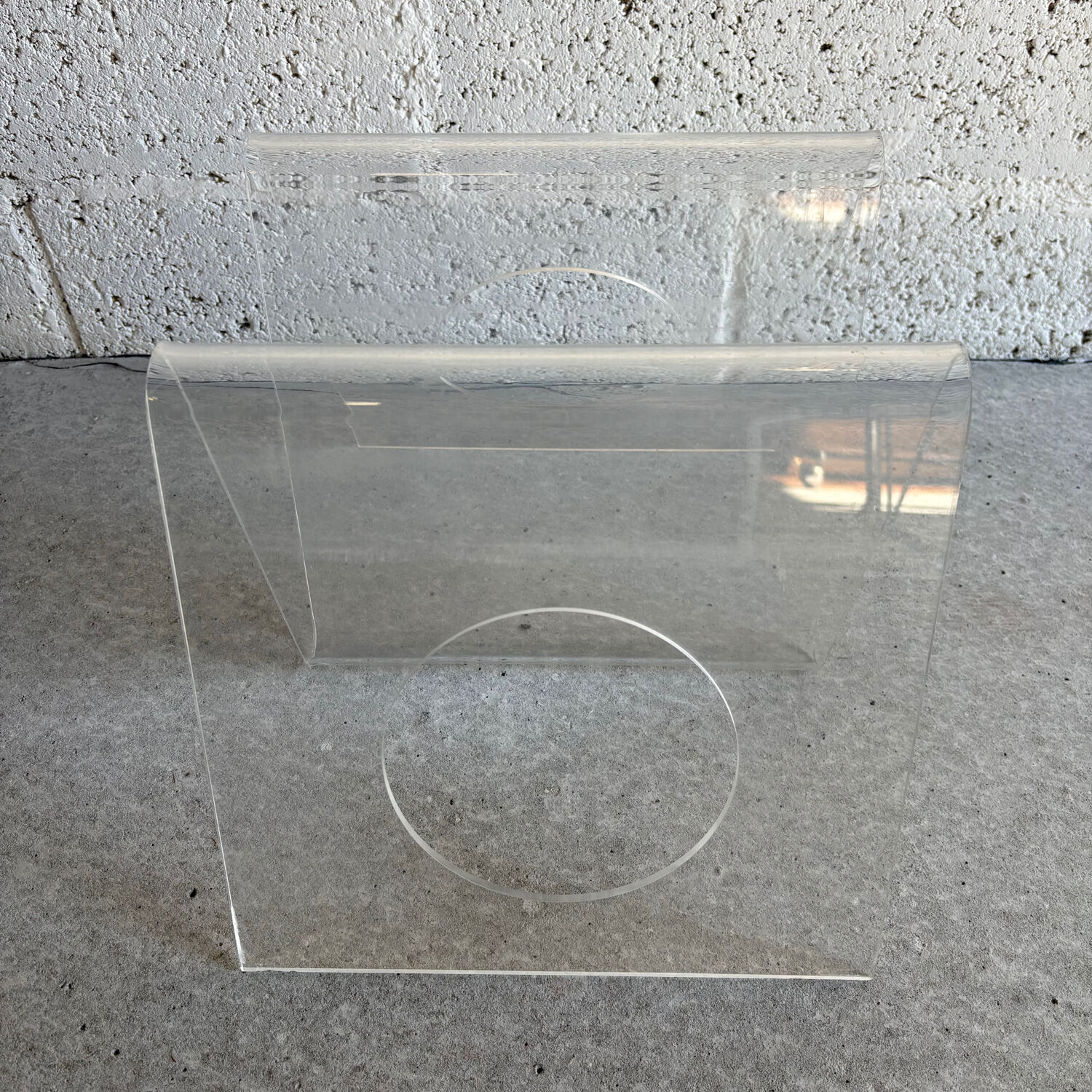 A Plexiglas magazine rack for Roche Bobois, 1970.