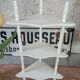 White lacquered corner shelf.