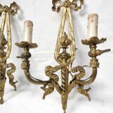 Pair of antique bronze wall lights. Louis style candlestick lamps.
