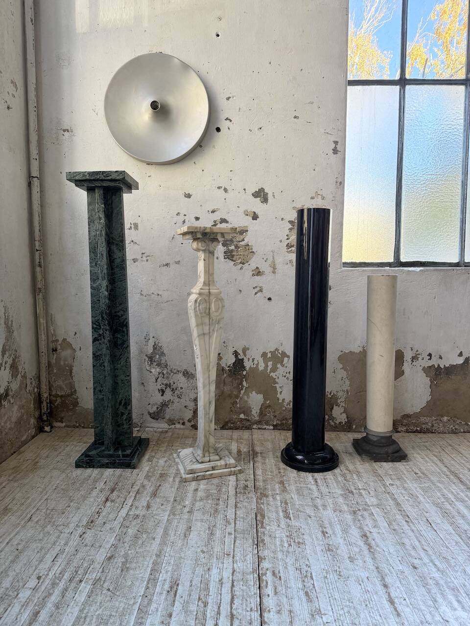 Set of 4 marble columns or pedestals.