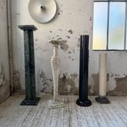 Set of 4 marble columns or pedestals.