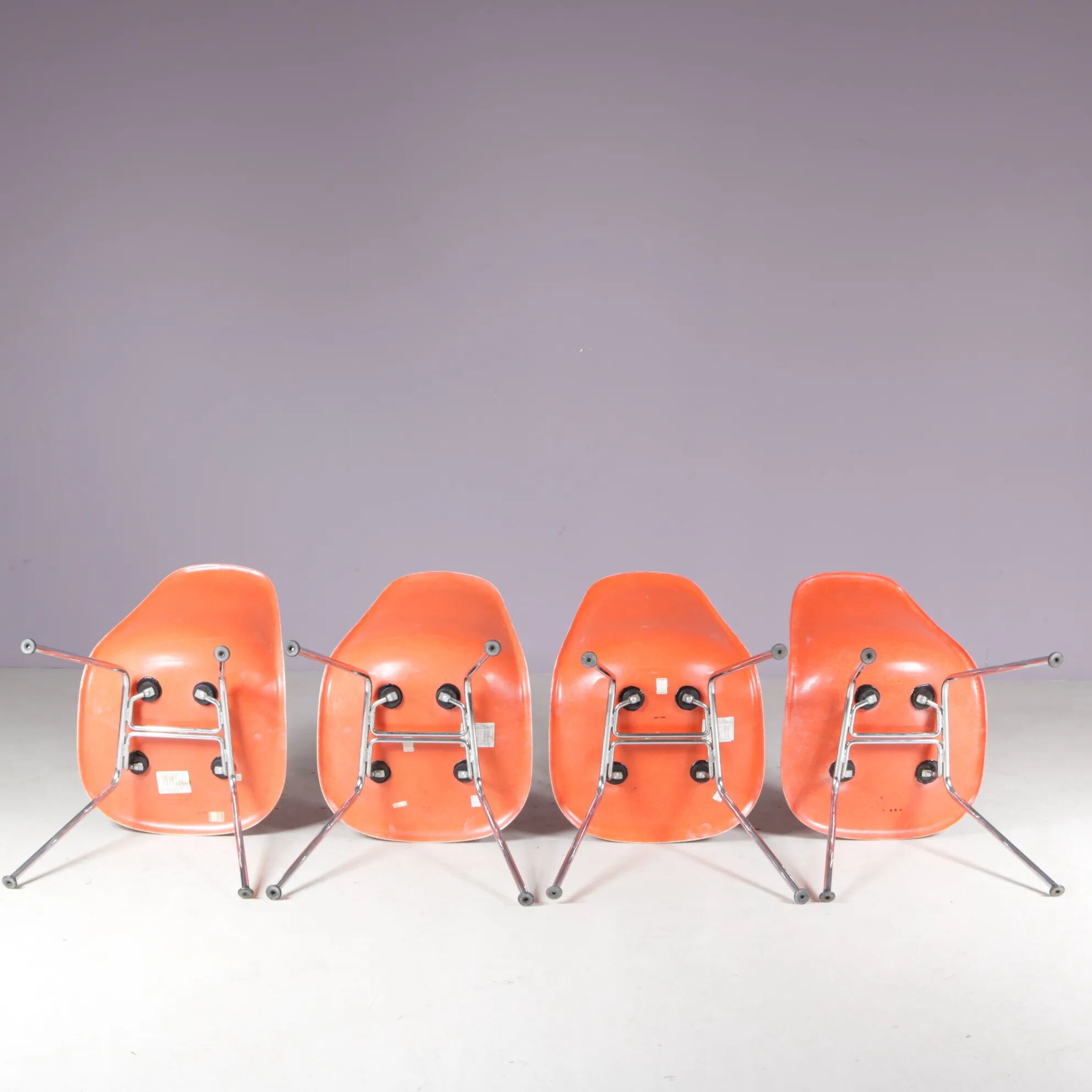1960s dining chairs in orange fiberglass on chrome metal H-base / Charles & Ray Eames / Herman Miller, USA