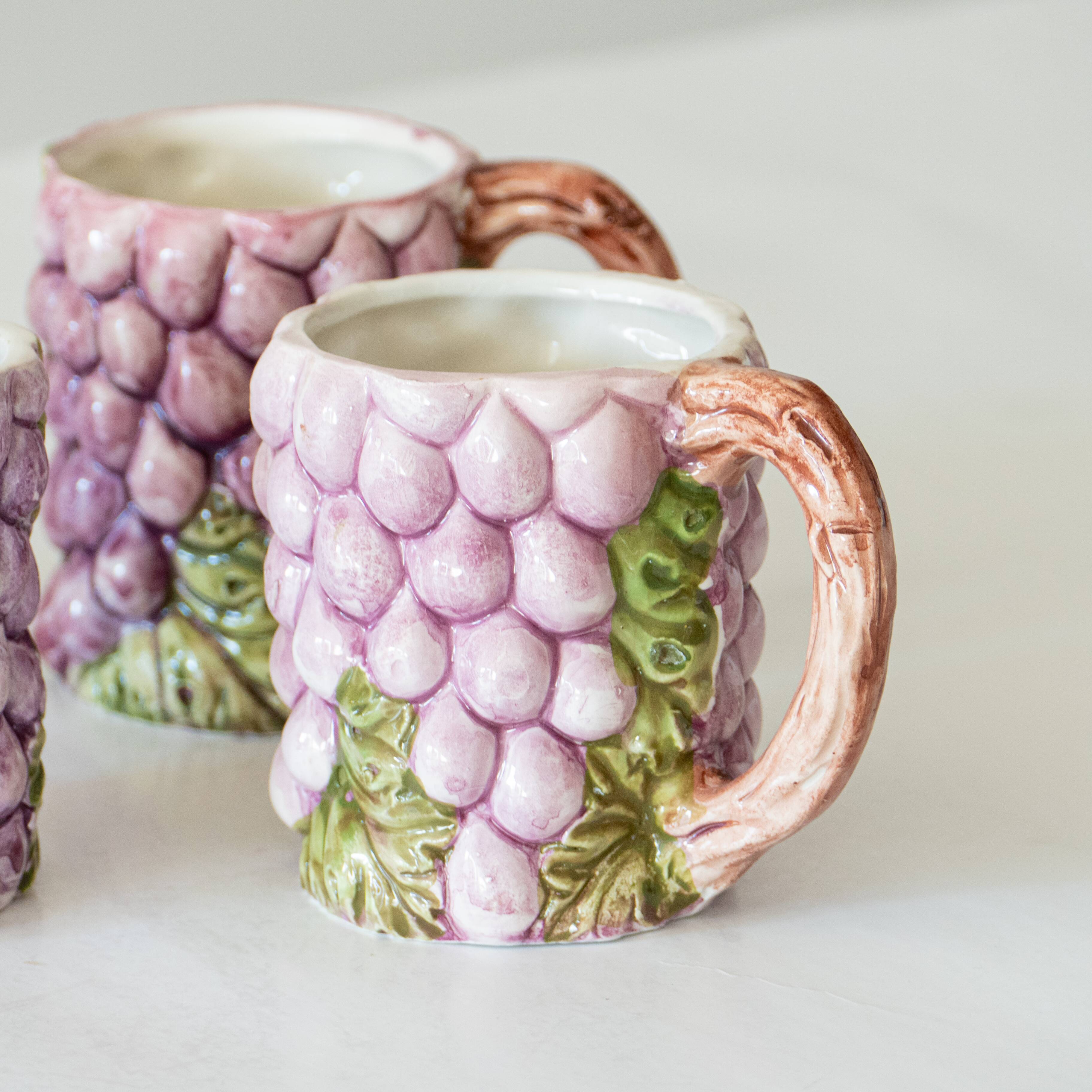 4 old mugs in Bassano slip signed