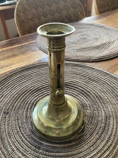 19th century brass candlestick says "to binet"