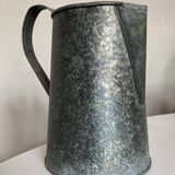 Old garden pitcher vase in folded zinc