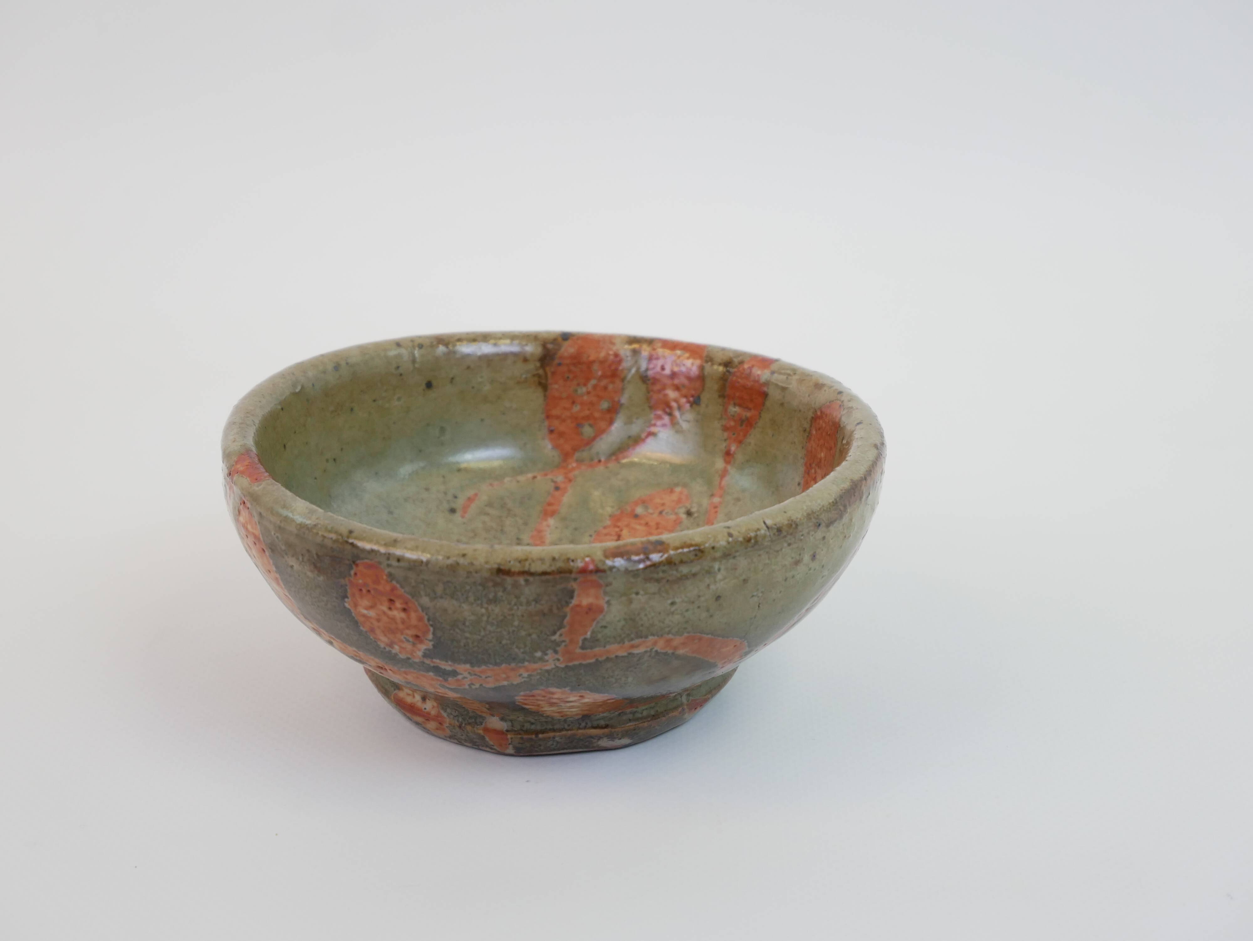 Small bowl in water green glazed ceramic with coral pink pattern