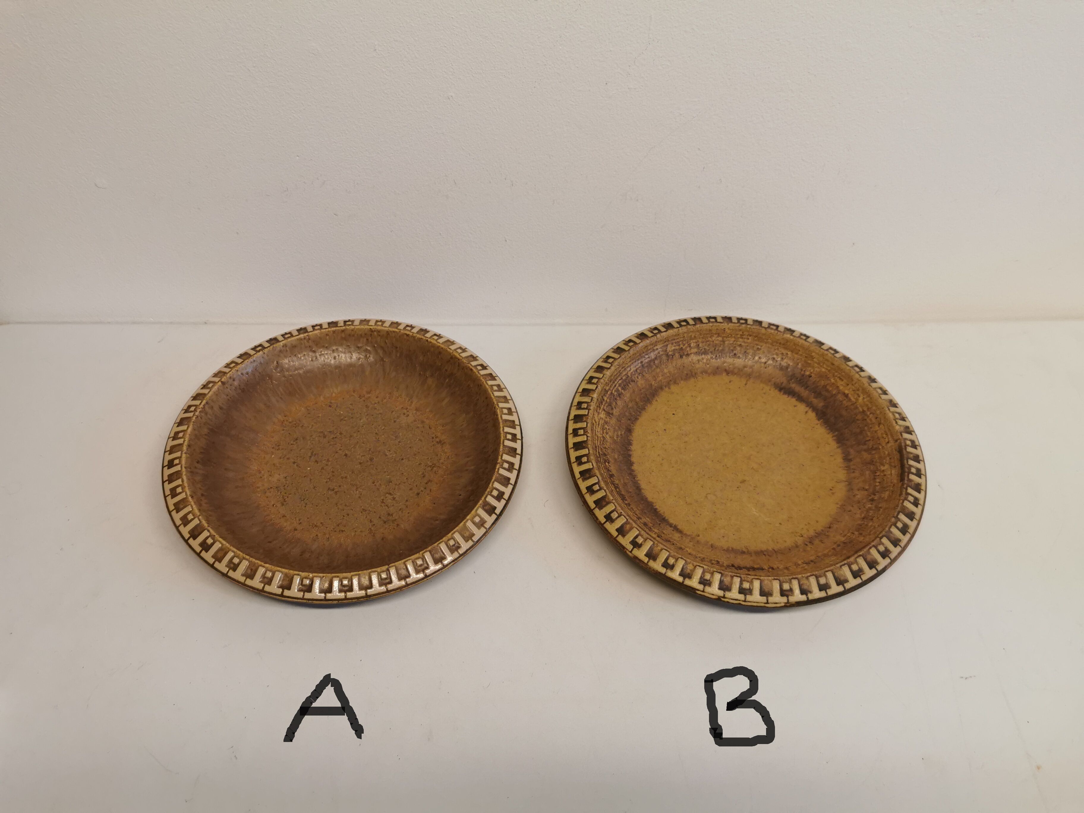 Ceramic plates, designed and made by Danish Ravnild (both stamped and signed)