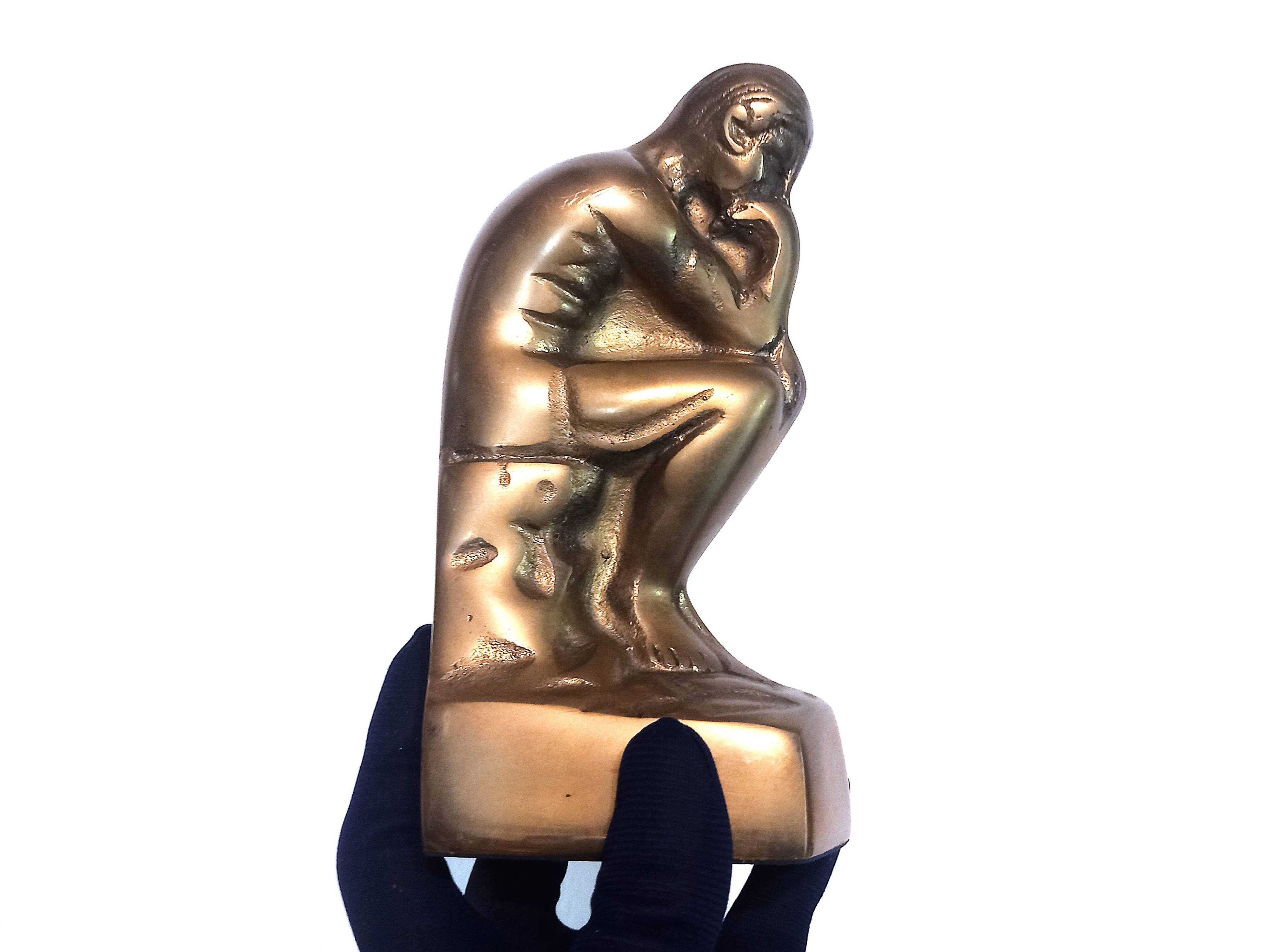Pair of brass "thinker" bookends