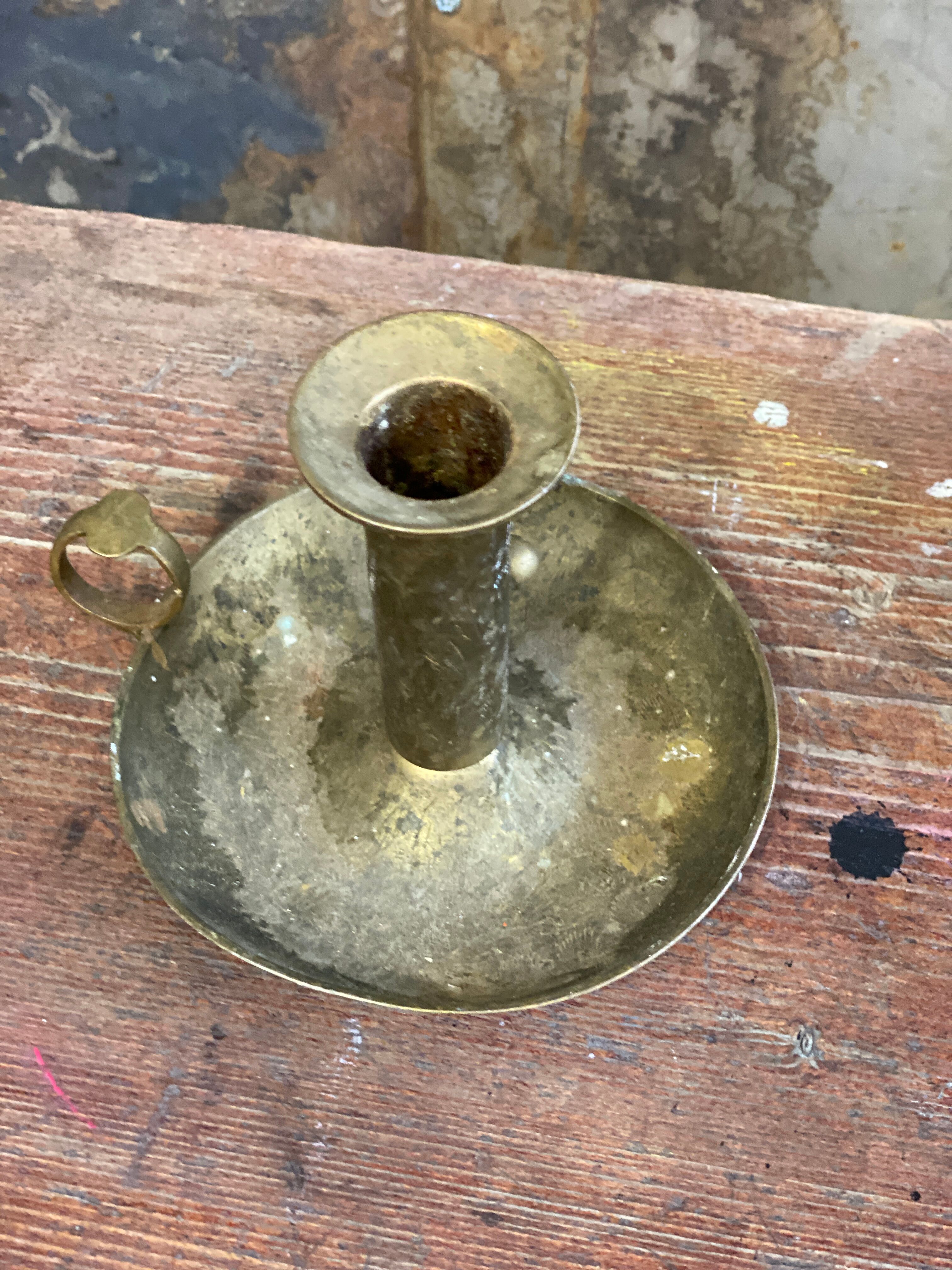 Brass hand candle holder