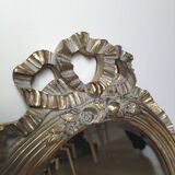 Miroir ovale doré style Louis XVI