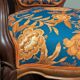 Restored Louis-Philippe cabriolet armchair, blue and orange floral fabric.