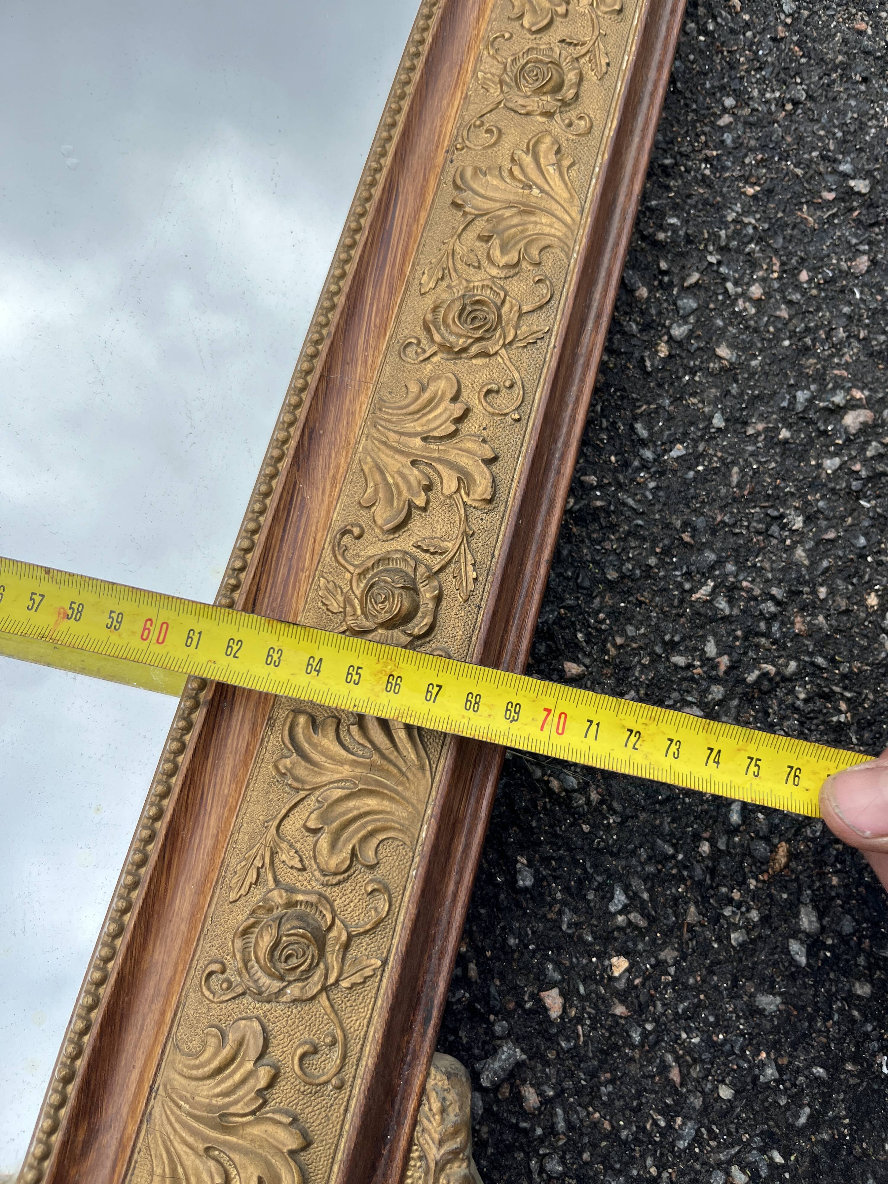 Large gold mirror in Louis XVI style with laurel crown, 121 cm.