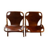 Pair of leather and bamboo armchairs