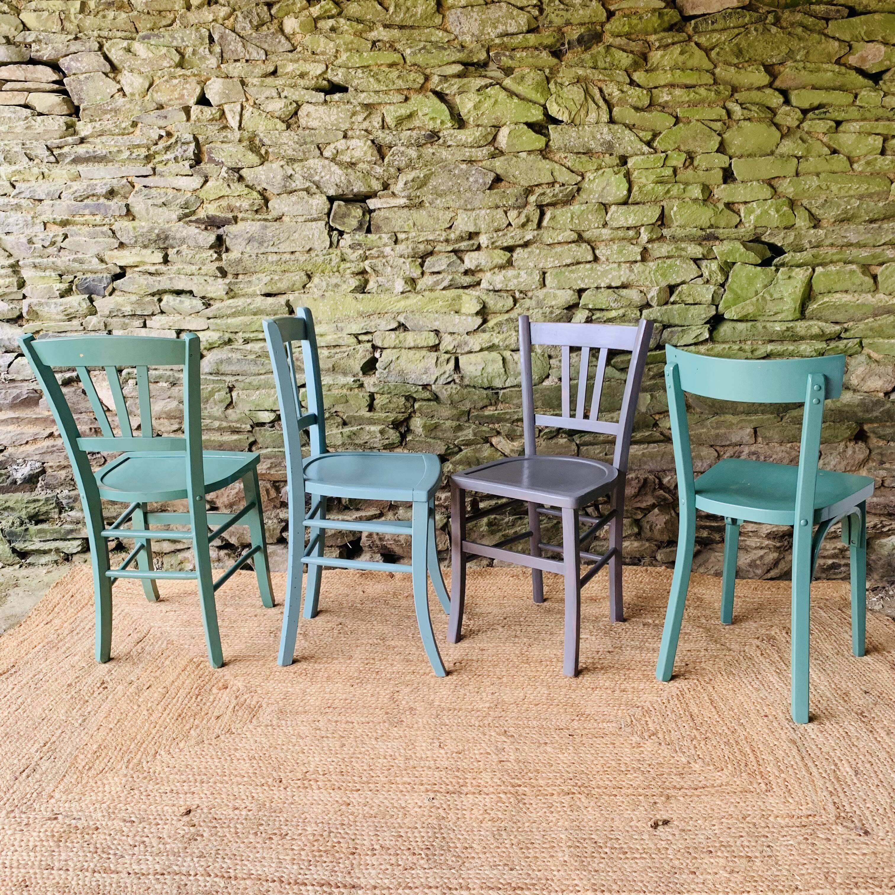 Set of four mismatched bistro chairs