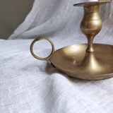 Large hand candlestick in gilded brass