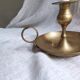 Large hand candlestick in gilded brass