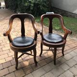Pair of antique brown swivel armchairs in upholstery fabric, wooden frame, Hungary circa 1900.