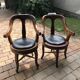 Pair of antique brown swivel armchairs in upholstery fabric, wooden frame, Hungary circa 1900.