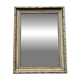 Mirror in a frame with a moulding.